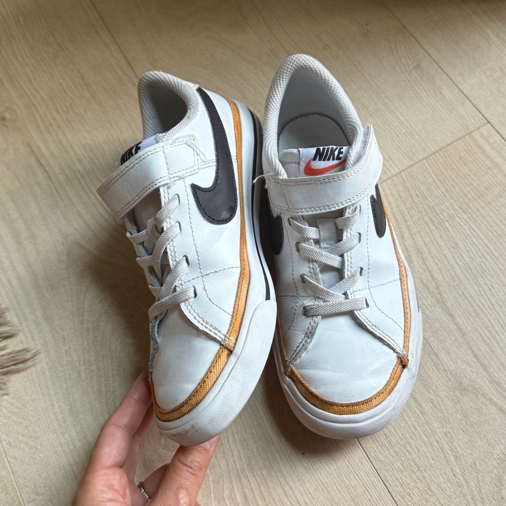 Nike White Sneakers with Black and Gold Details